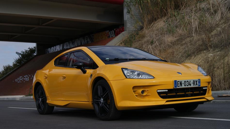yellow sports car on the road