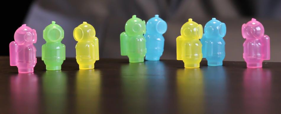 Colorful and beautiful figures of the divers, with reflections