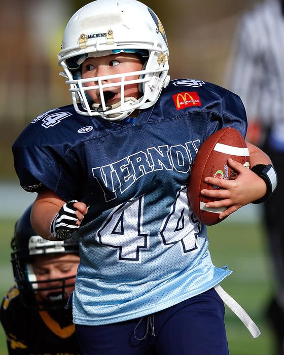 Football Running Back close-up on blurred background