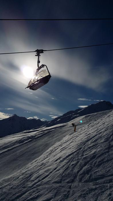 cable car with carriages in the ski resort in the evening