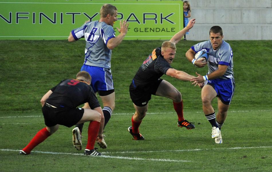Rugby players, playing on the field, with the ball, on the competition