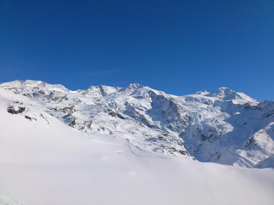 Beautiful, snowy Glacier Di Verrà in the winter, at blue sky on background