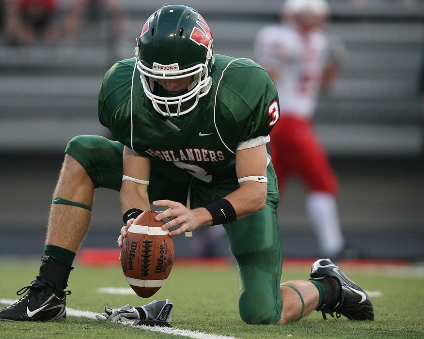Football players, on the green and white field, on the competition
