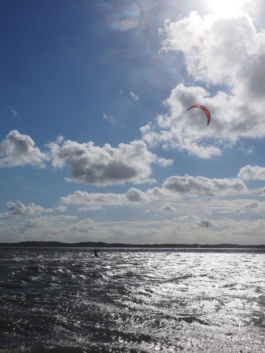 kitesurfing on the waves in the north sea