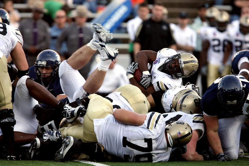 American Football, blocking, male players tackling ball