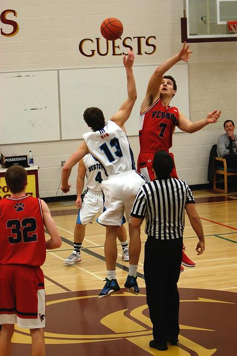 Players in uniform, with the ball, on the colorful court, on the competition