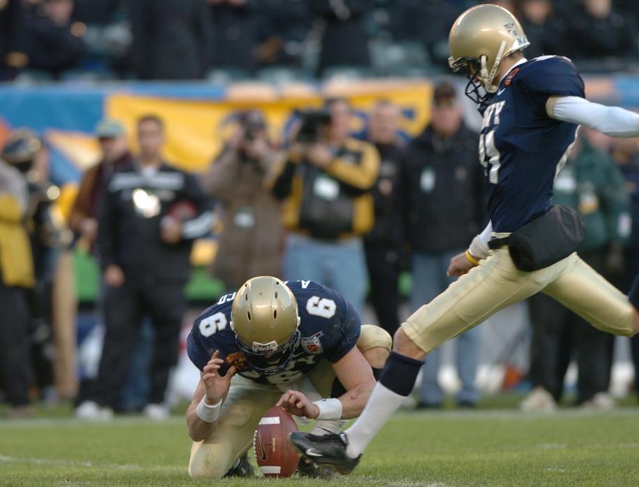 players fight for the ball in american football