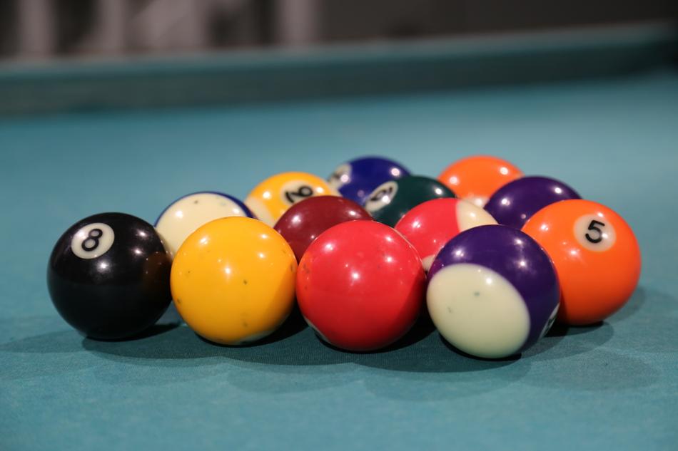 Close-up of the colorful, shiny billiard balls, on the billiard table