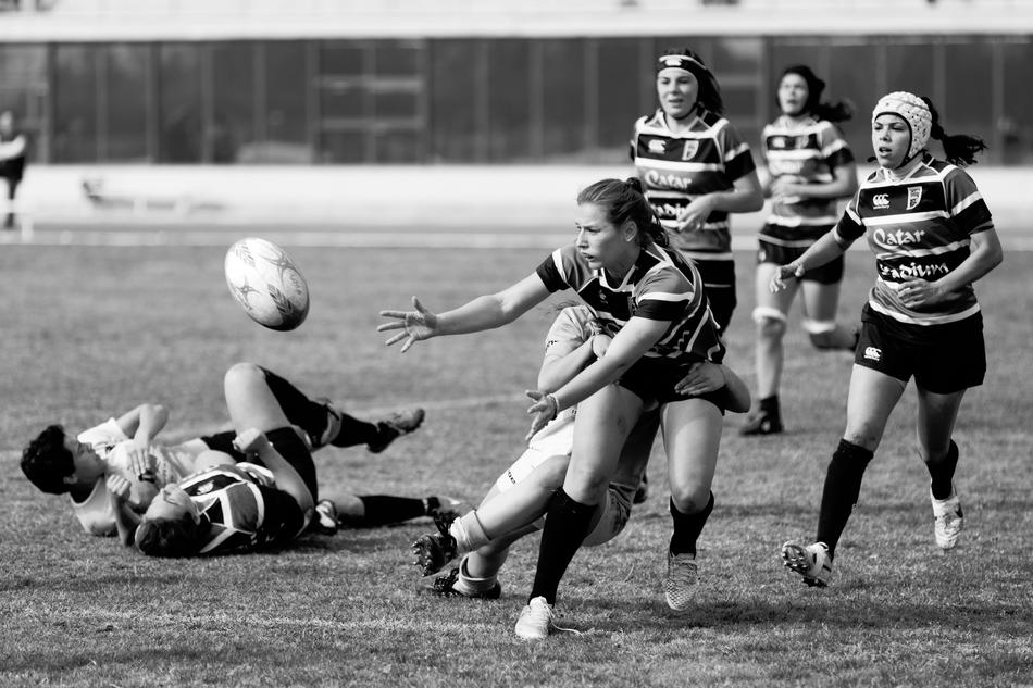 athletes on the field in black and white blurred background