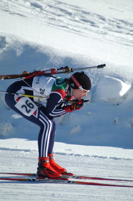 olympic skier is going down the mountainside
