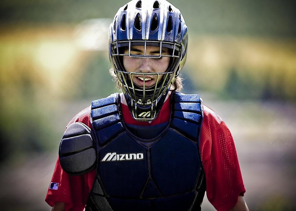 Canadian baseball player in protective clothing and helmetet