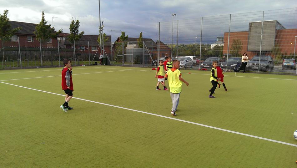 children playing football on the field