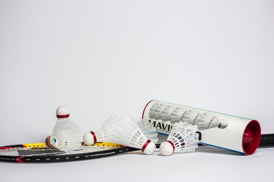 flounces next to the box and racket