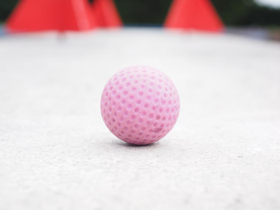 Close-up of the beautiful, pink mini golf ball in light