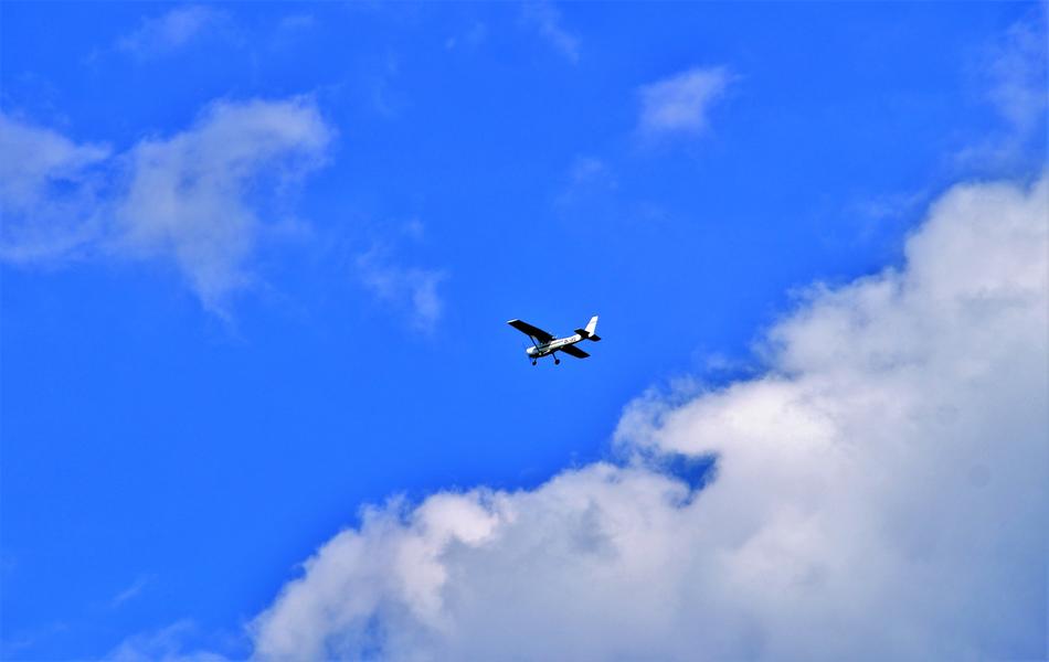 small vintage Aircraft in Blue Sky at Summer