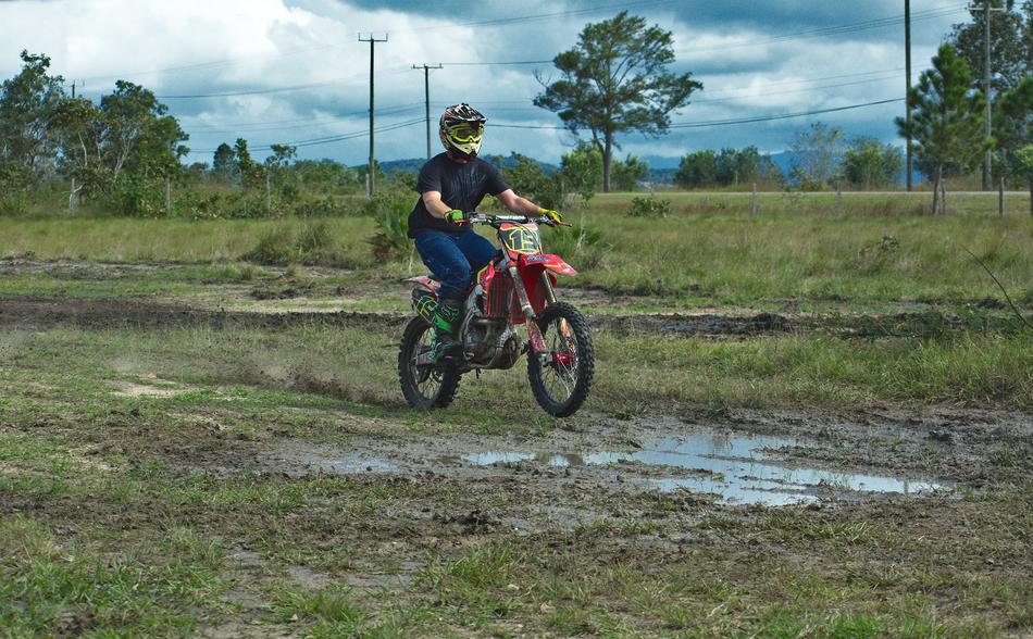 Motocross in puddles among nature