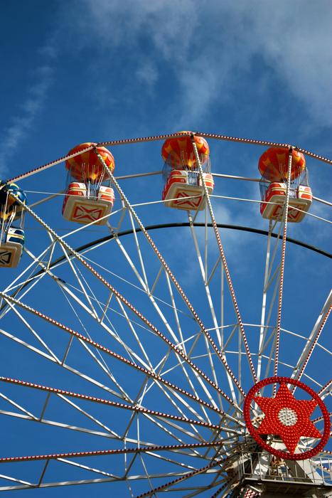 Ferris Wheel at Blue Skies background