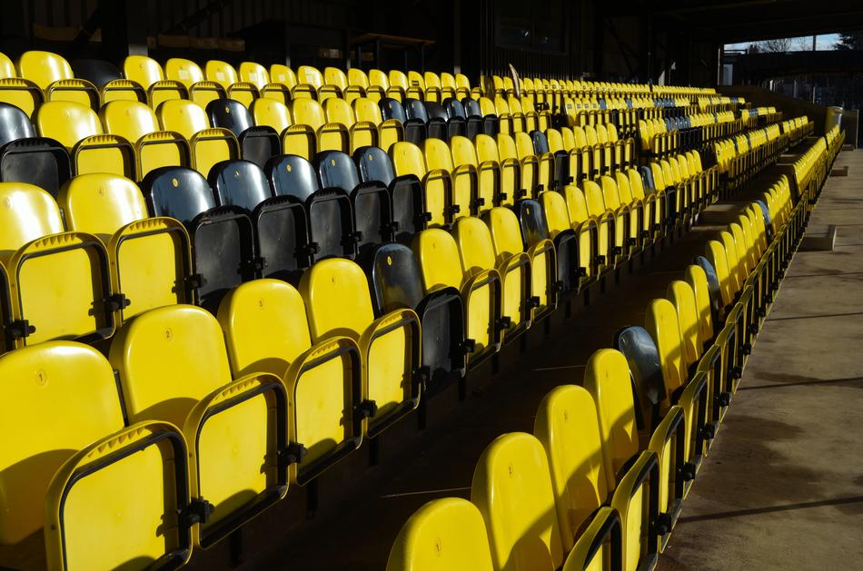 yellow and black seats in the stadium