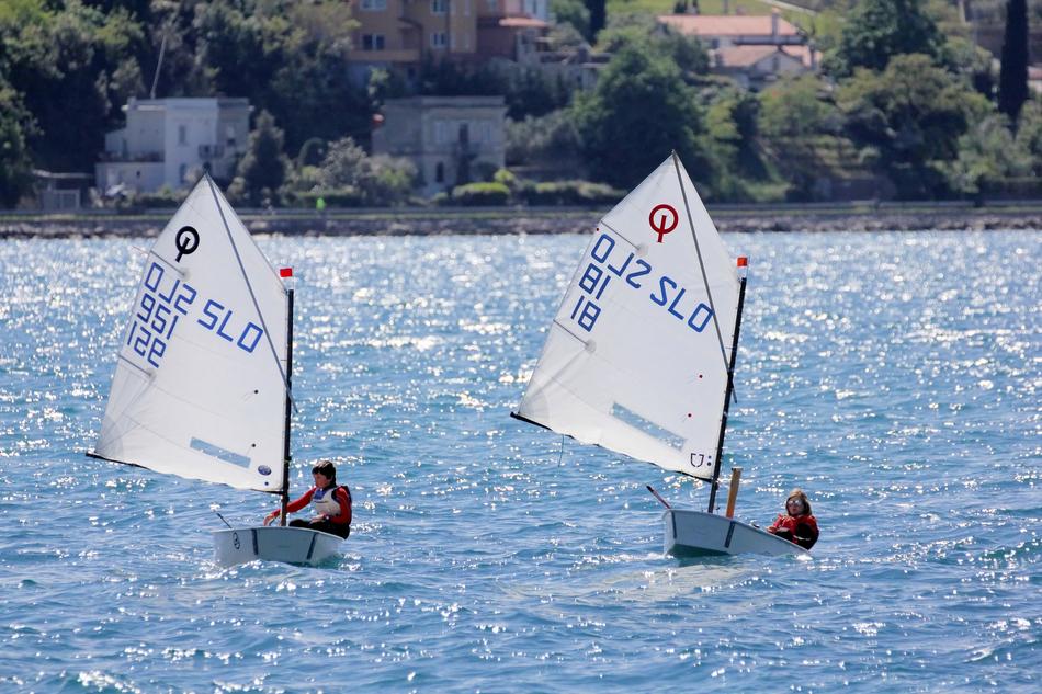 a pair of sailing boats on the lake during the competition