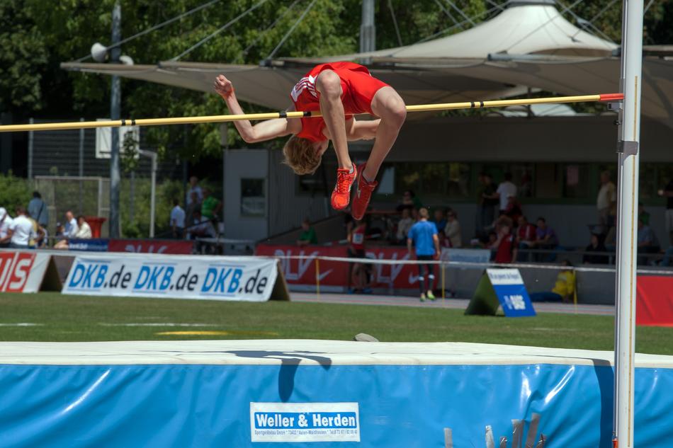 pole vault, sportsman in red uniform