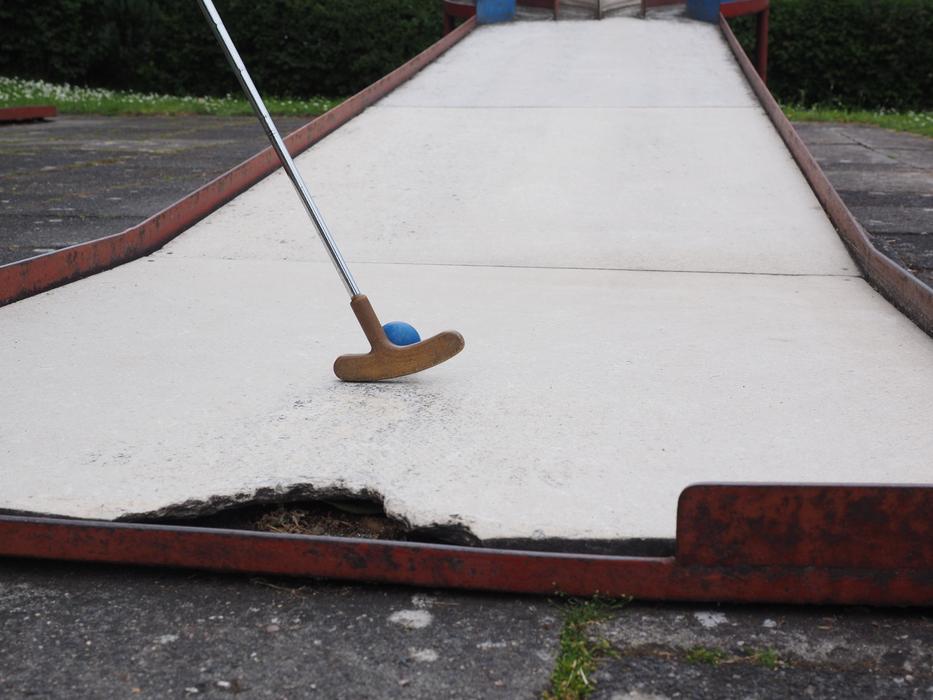 playing on the mini golf course