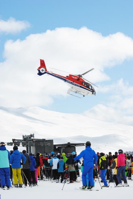 helicopter over crowd of skiers at scenic Mountains, Sweden, Hemavan