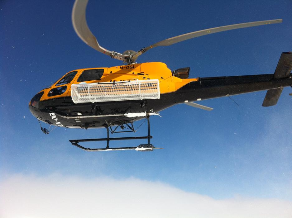 Helicopter over Ski Mountain Top