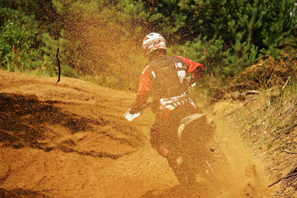motocross in dust, rear view