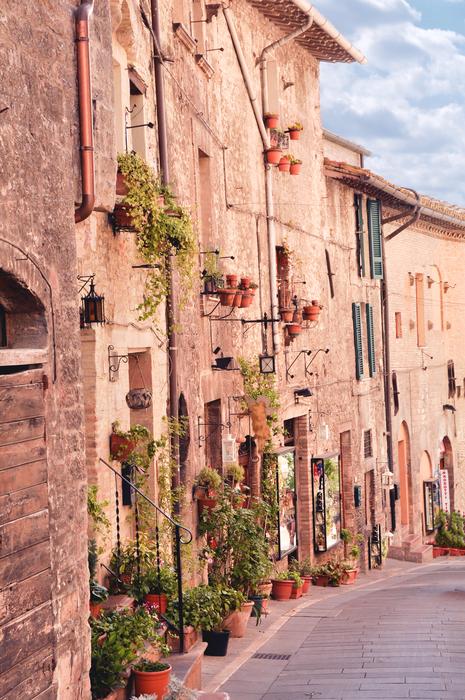 picturesque old buildings with with flower pots at walls, italy, Assisi