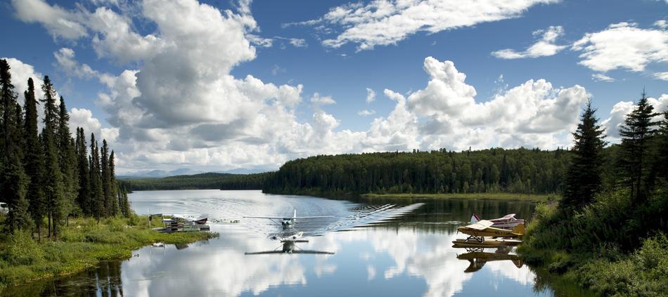 airplane on the water in the nature of alaska