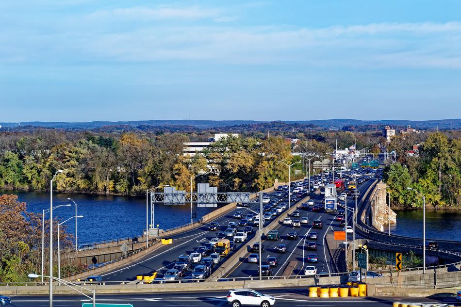 movement of cars on a bridge over a river