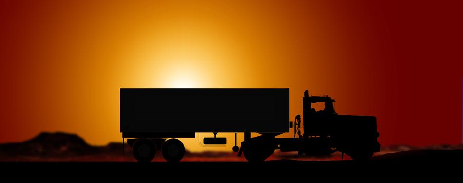 truck with trailer on golden sunset background