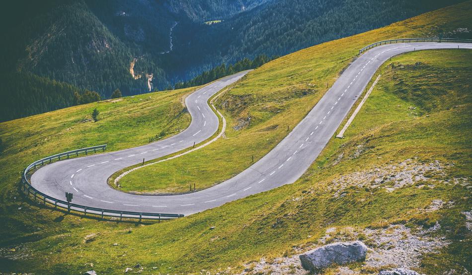 Beautiful landscape of the winding road on the green and yellow mountains