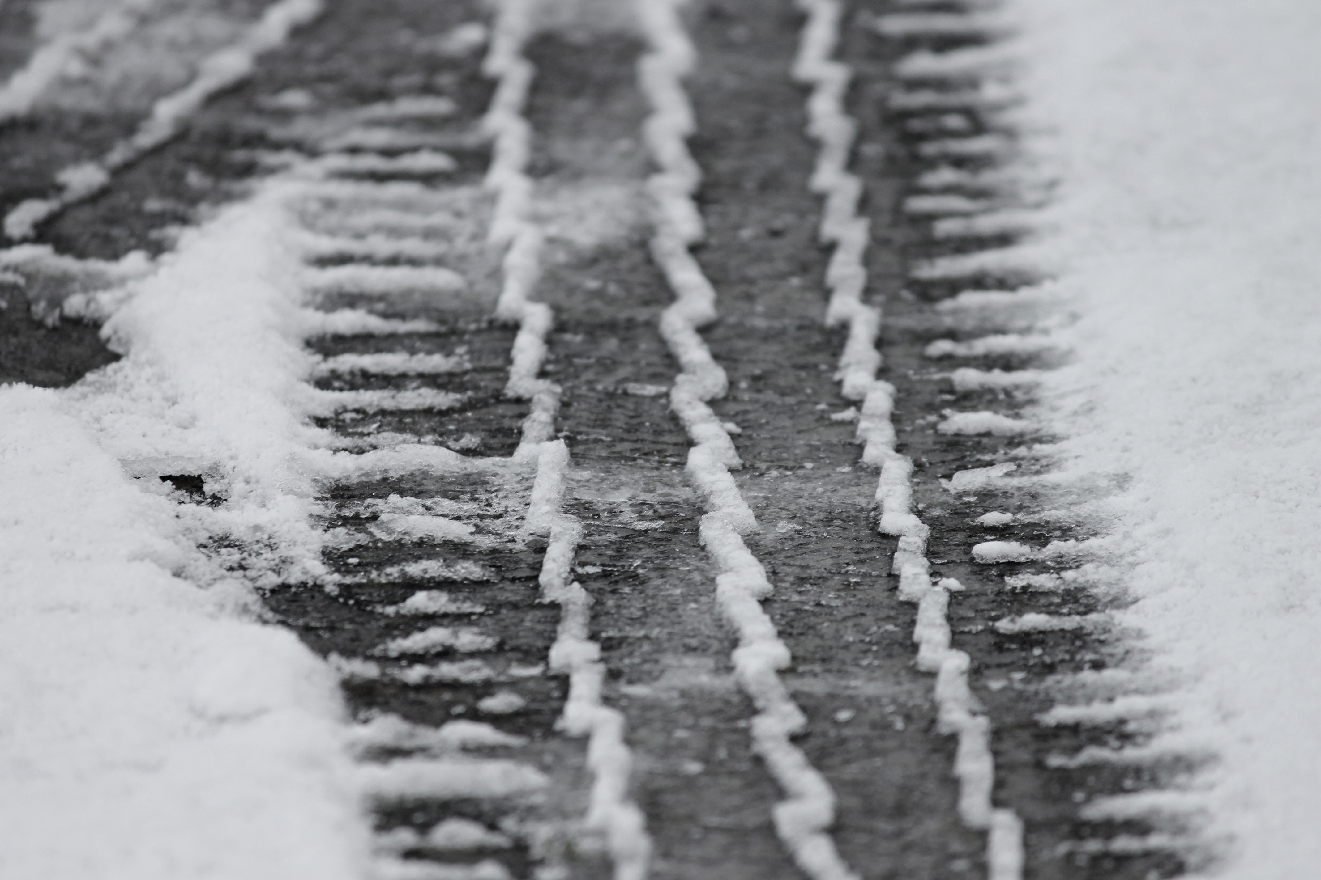 What is the title of this picture ? Tire Tracks Snow free image