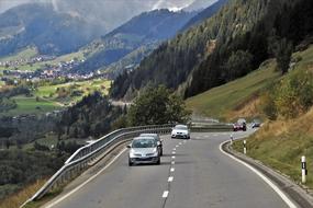 landscape of traffic on winding Highway at scenic Mountains