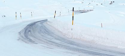 road through the mountain pass in the snow