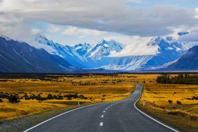 empty road leading to mountains