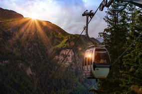 alpine cableway in the morning sun