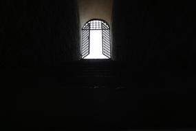window with bars in a dark room