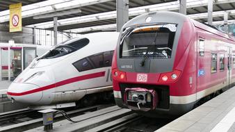 high speed trains on rails at a railway station