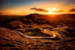 road through the hills at sunset