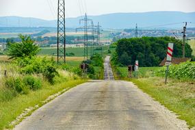 power lines among empty road