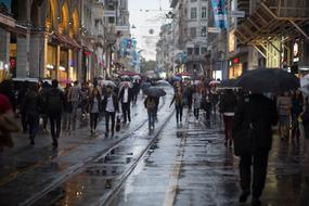 crowd of people with umbrellas