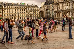 People on the beautiful street of Paris in France, on 14 July