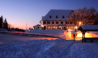 building near road at scenic winter evening