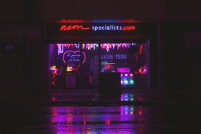 neon sign on store at night