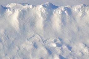 clean snow on the side of the road