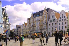 people walking on street in old european city