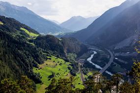 panoramic view of the valley in the alps on a sunny day