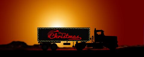 merry christmas, writing on side of trailer at sunset sky, collage
